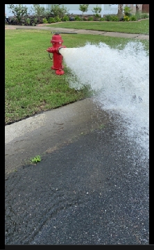 Open fire hydrant spewing water